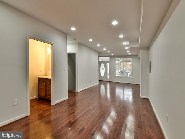 unfurnished living room featuring dark hardwood / wood-style floors