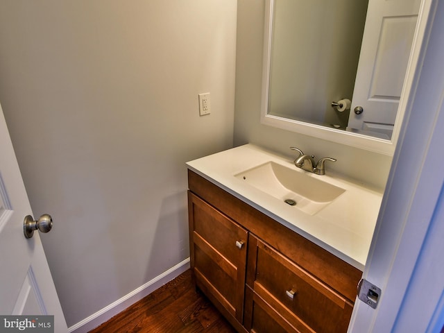 bathroom featuring vanity and wood-type flooring