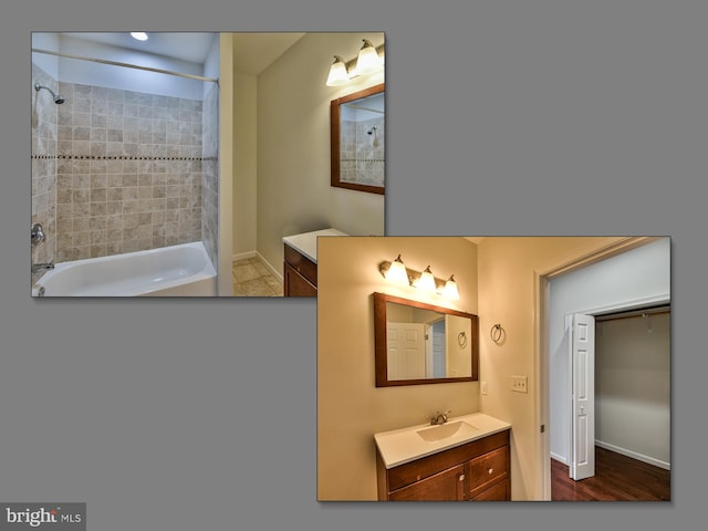 bathroom featuring wood-type flooring, vanity, and tiled shower / bath