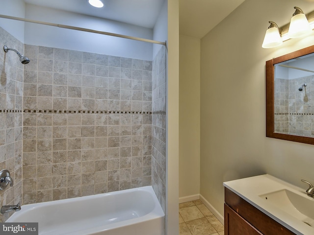 bathroom featuring vanity, tiled shower / bath combo, and tile patterned flooring