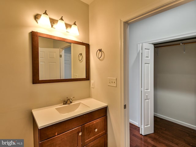 bathroom with vanity and hardwood / wood-style flooring