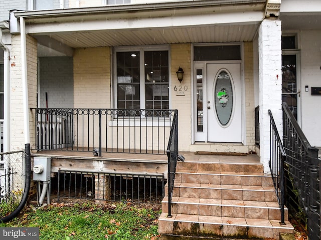 entrance to property with a porch