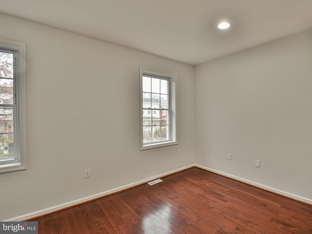 spare room featuring hardwood / wood-style floors