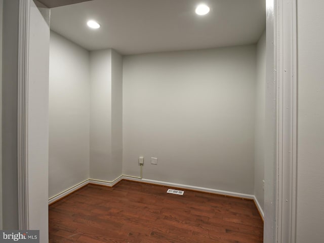 spare room with dark hardwood / wood-style floors