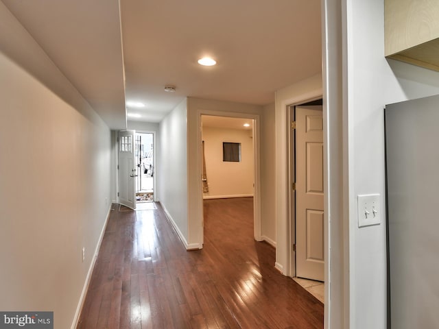 corridor featuring dark hardwood / wood-style floors