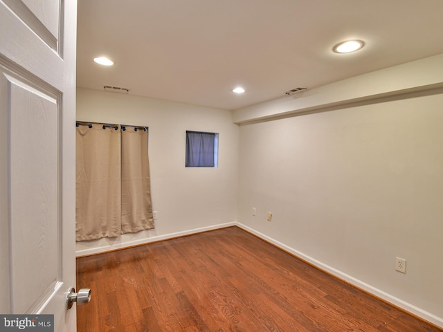 spare room featuring hardwood / wood-style flooring