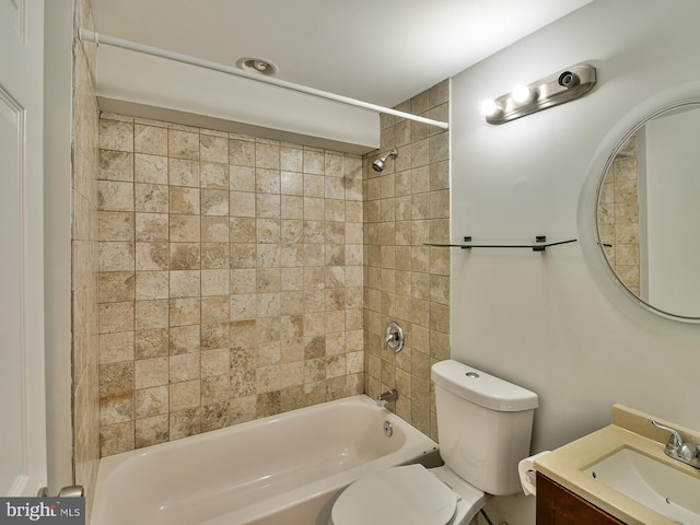 full bathroom featuring vanity, toilet, and tiled shower / bath