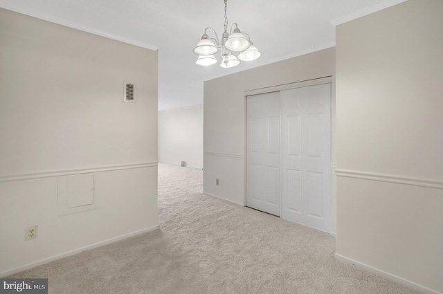 5911 Edsall Rd Unit 1107, Alexandria, VA 22304 - unfurnished dining area with a chandelier, carpet flooring, crown molding, and baseboards