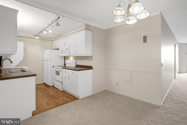 5911 Edsall Rd Unit 1107, Alexandria, VA 22304 - kitchen featuring white appliances, a sink, dark countertops, and light colored carpet