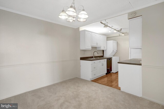 5911 Edsall Rd Unit 1107, Alexandria, VA 22304 - kitchen featuring dark countertops, a chandelier, a sink, range, and dark wood-style flooring