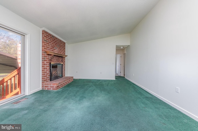 unfurnished living room featuring a fireplace, dark carpet, and lofted ceiling