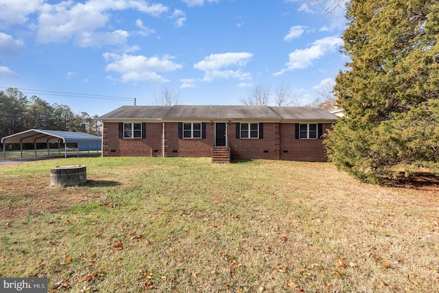 view of front of property featuring a front lawn and a carport