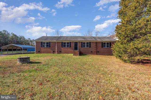 rear view of property featuring a yard and a carport