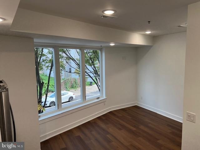 interior space with dark hardwood / wood-style flooring