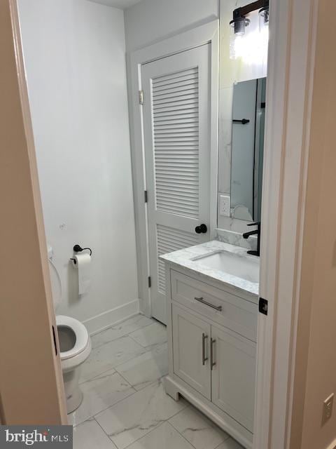 bathroom with toilet and vanity