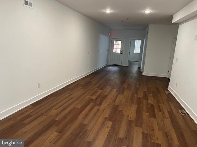 foyer entrance featuring dark hardwood / wood-style floors