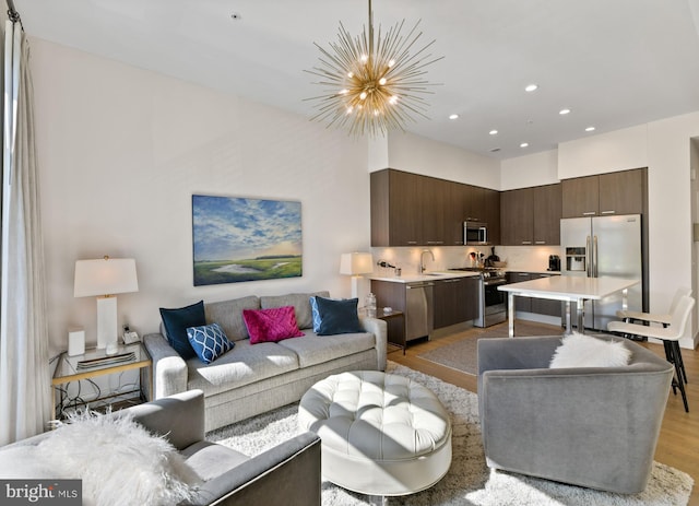 525 Water St SW Unit 326, Washington, DC 20024 - living room with light wood-style floors, a chandelier, and recessed lighting