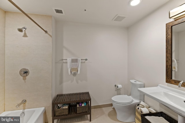 bathroom featuring tile patterned flooring, toilet, and a wall mounted air conditioner