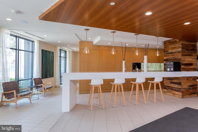 525 Water St SW Unit 326, Washington, DC 20024 - kitchen featuring pendant lighting, a kitchen breakfast bar, wood ceiling, recessed lighting, and light countertops