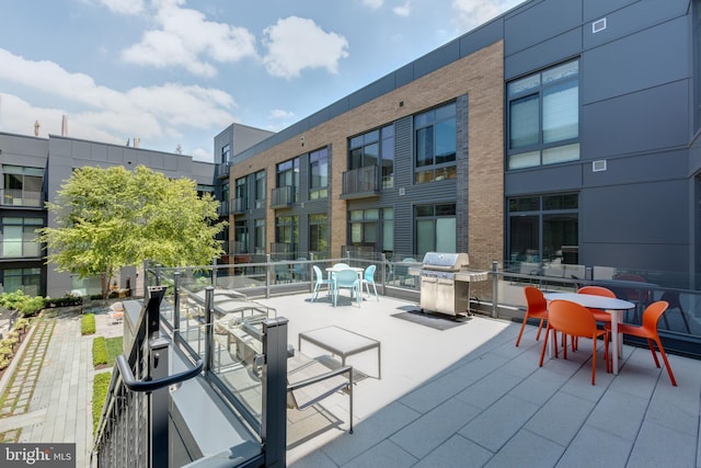 view of patio / terrace with a balcony and grilling area