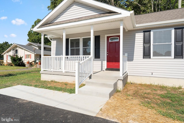 view of front facade with a porch and a front yard