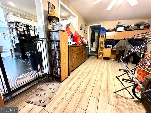 interior space with light wood-type flooring and ceiling fan