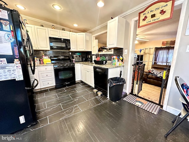 kitchen featuring black appliances, tasteful backsplash, light stone counters, white cabinets, and ceiling fan