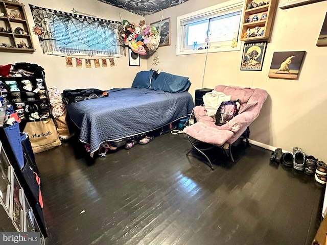 bedroom featuring hardwood / wood-style floors