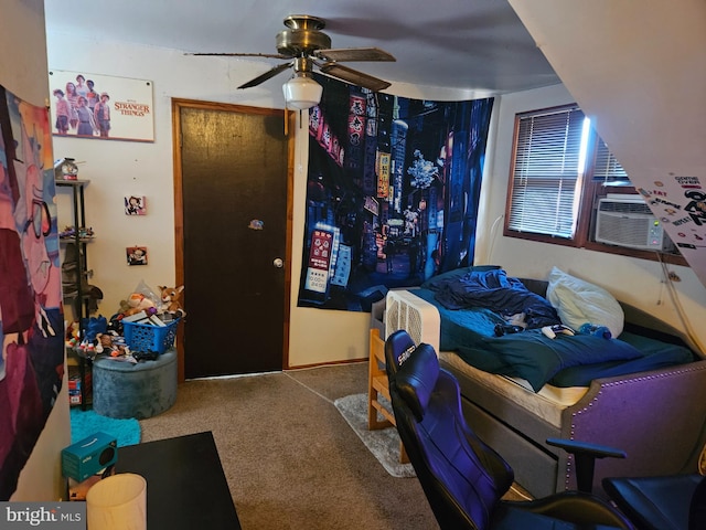 bedroom with carpet, ceiling fan, and cooling unit