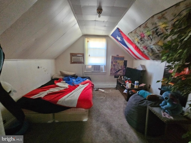 carpeted bedroom featuring a wall unit AC and lofted ceiling