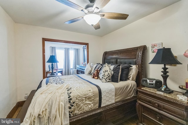 bedroom featuring hardwood / wood-style flooring and ceiling fan