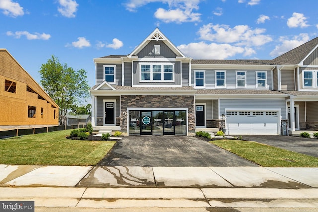 view of front of home featuring a garage and a front lawn