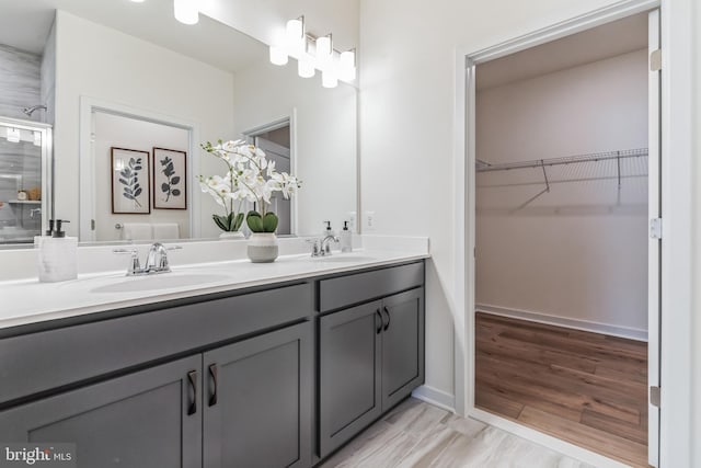 bathroom with vanity and hardwood / wood-style floors