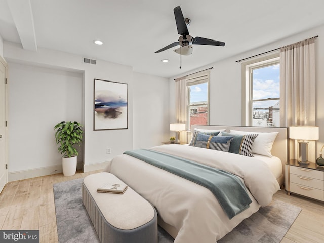 bedroom with ceiling fan and light wood-type flooring