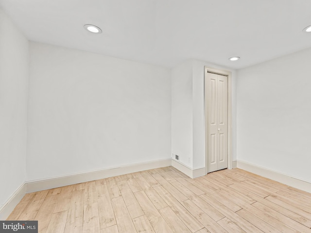 spare room featuring light wood-type flooring