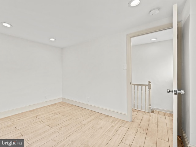 spare room featuring light wood-type flooring