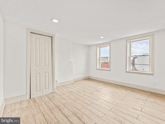 unfurnished room featuring light hardwood / wood-style flooring