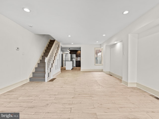 unfurnished living room featuring light hardwood / wood-style flooring