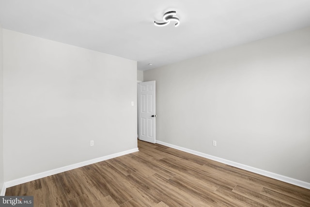 spare room featuring hardwood / wood-style flooring