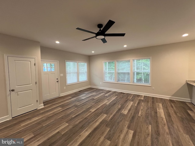 interior space with dark hardwood / wood-style floors and ceiling fan