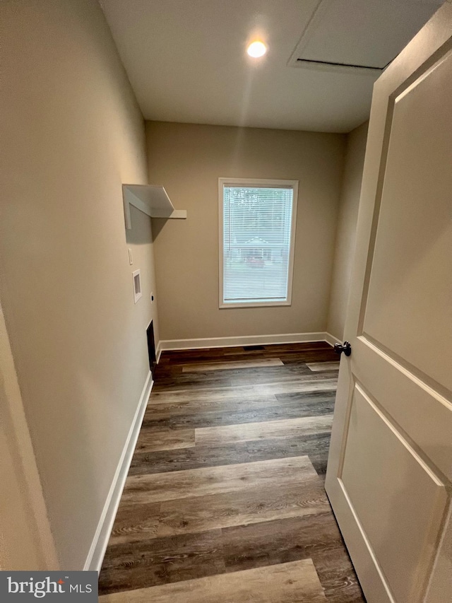 washroom with hookup for a washing machine, dark hardwood / wood-style flooring, and hookup for an electric dryer