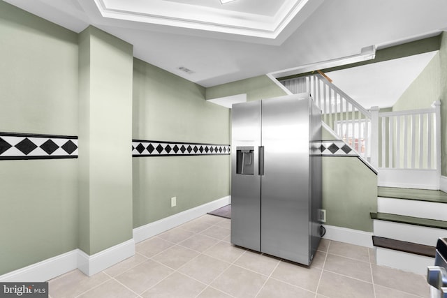 kitchen with stainless steel fridge and light tile patterned floors