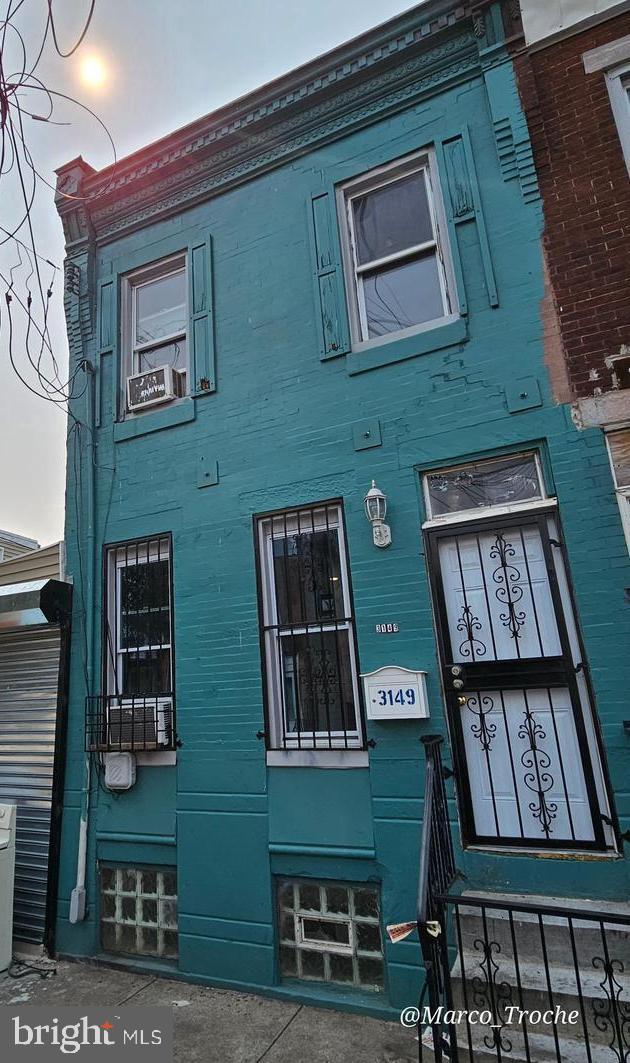 view of side of home with cooling unit