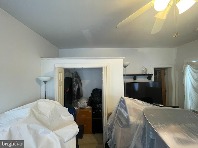 bedroom featuring ceiling fan and a closet