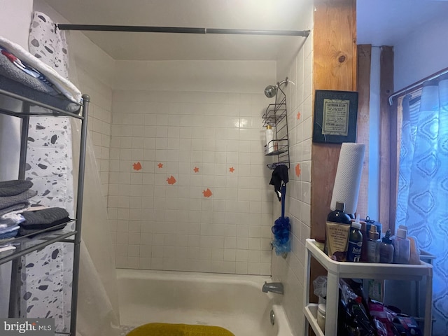 bathroom with shower / bath combination with curtain