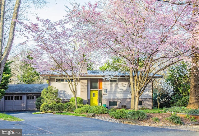 view of front of house featuring an outbuilding and a garage