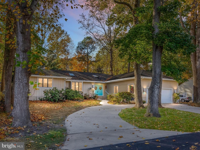 ranch-style home featuring a garage