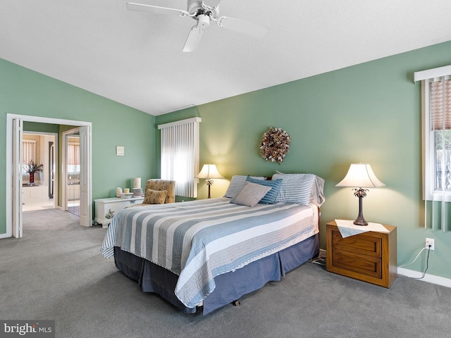 carpeted bedroom featuring multiple windows, ceiling fan, and vaulted ceiling