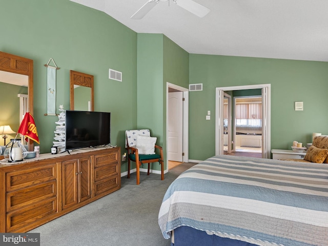 carpeted bedroom with ceiling fan and lofted ceiling