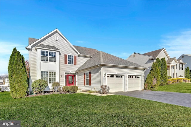 view of front property with a garage and a front lawn